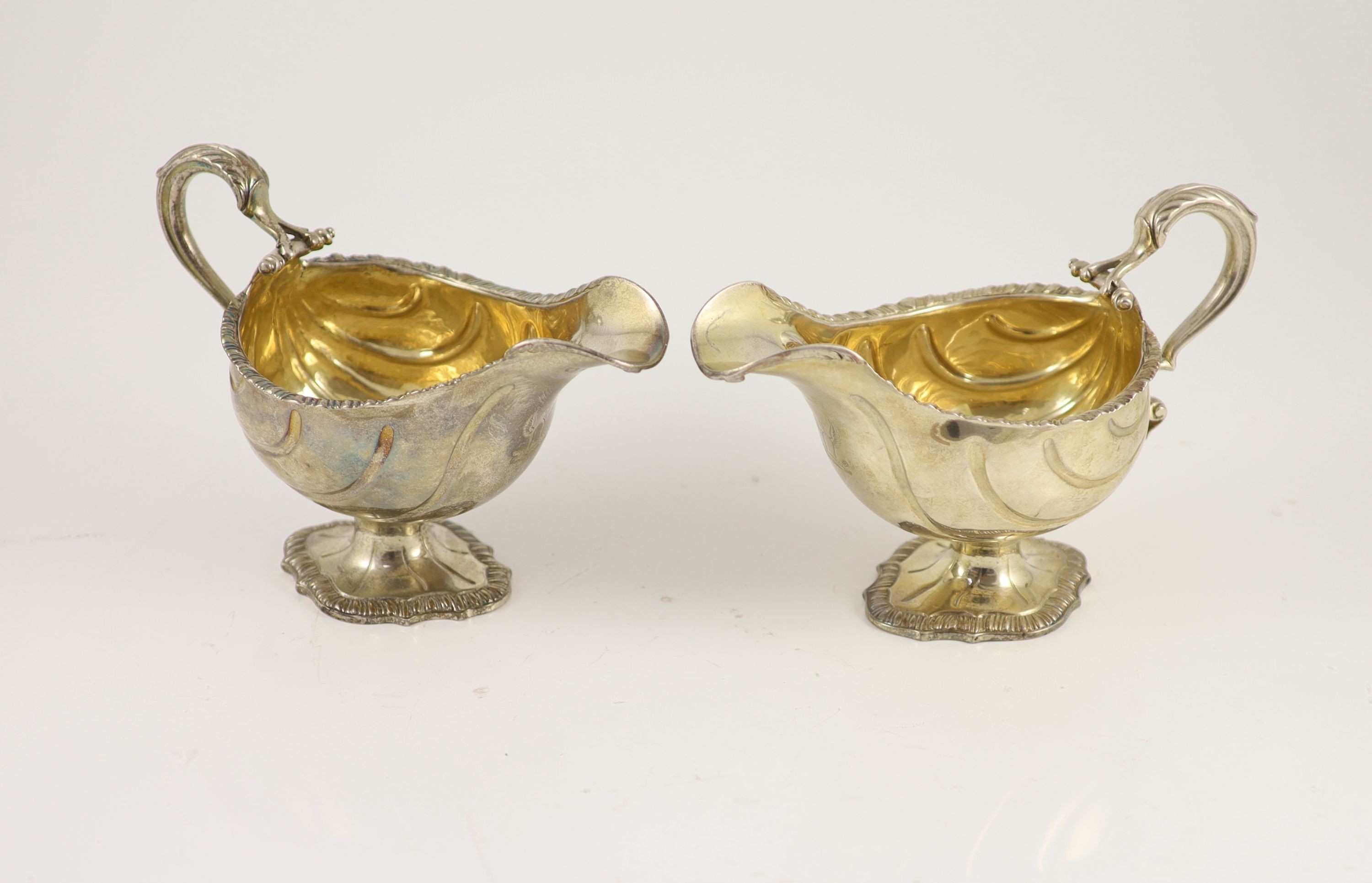 A pair of early George III silver oval pedestal sauce boats by Whyte & Holmes?